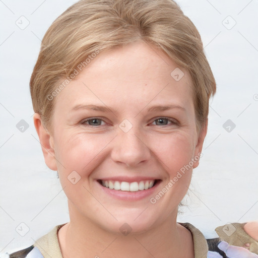 Joyful white young-adult female with short  brown hair and grey eyes