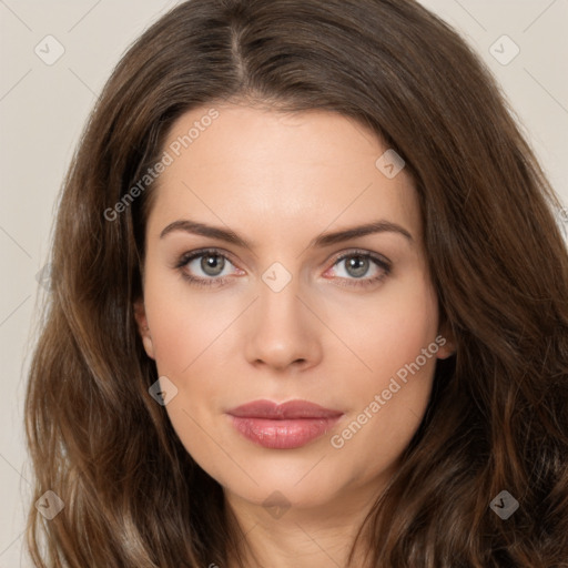 Neutral white young-adult female with long  brown hair and brown eyes