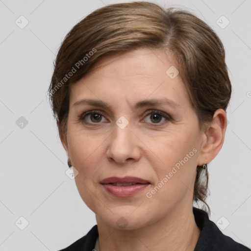 Joyful white adult female with medium  brown hair and grey eyes