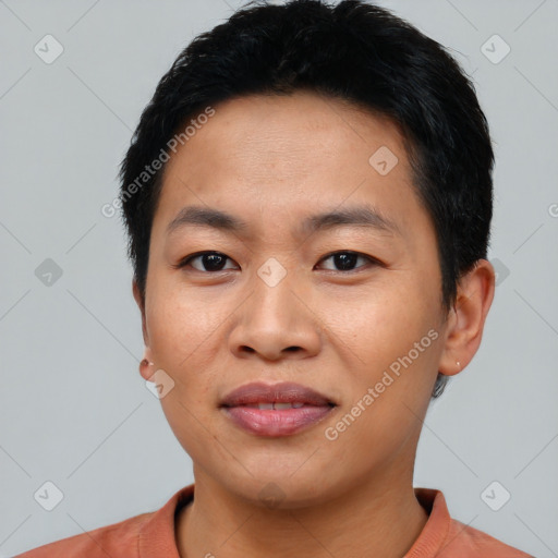 Joyful asian young-adult male with short  black hair and brown eyes