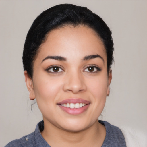 Joyful white young-adult female with medium  black hair and brown eyes
