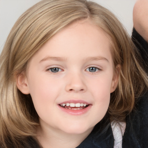 Joyful white child female with medium  brown hair and brown eyes