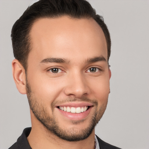 Joyful white young-adult male with short  brown hair and brown eyes