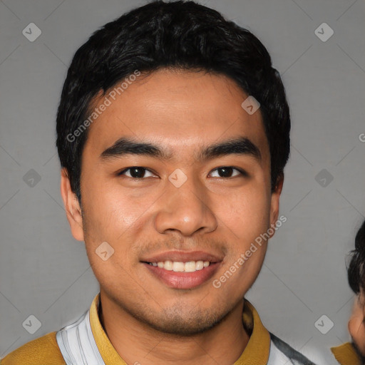 Joyful latino young-adult male with short  black hair and brown eyes