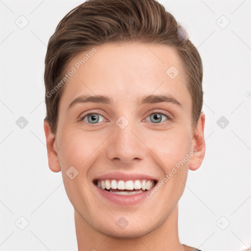 Joyful white young-adult male with short  brown hair and grey eyes