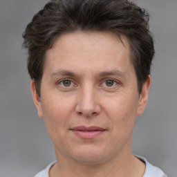 Joyful white adult female with short  brown hair and brown eyes