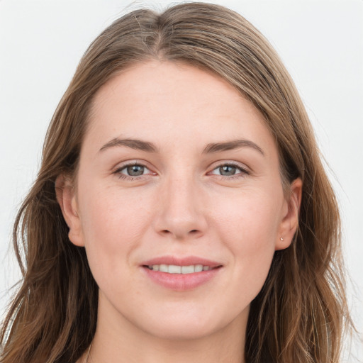 Joyful white young-adult female with long  brown hair and grey eyes