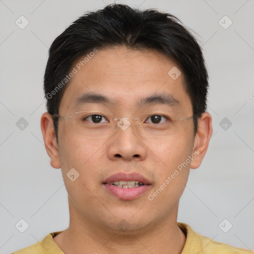 Joyful asian young-adult male with short  brown hair and brown eyes