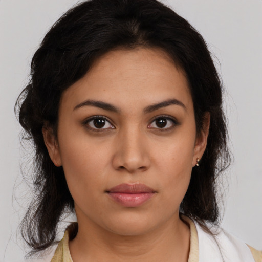 Neutral latino young-adult female with medium  brown hair and brown eyes