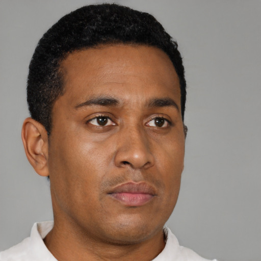 Neutral latino young-adult male with short  brown hair and brown eyes