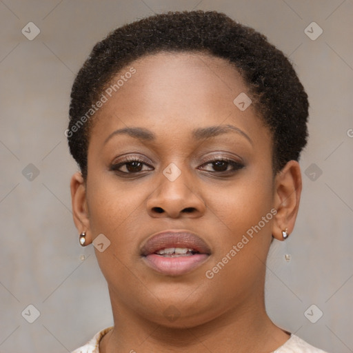 Joyful black young-adult female with short  brown hair and brown eyes