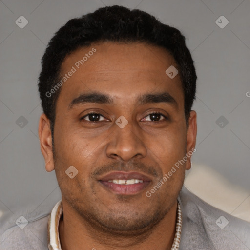 Joyful latino young-adult male with short  brown hair and brown eyes