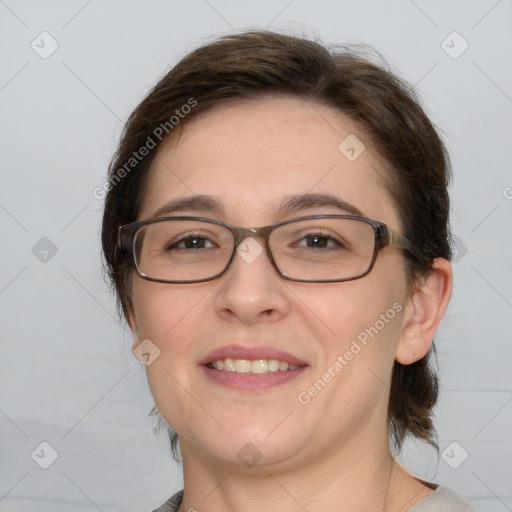 Joyful white adult female with medium  brown hair and brown eyes