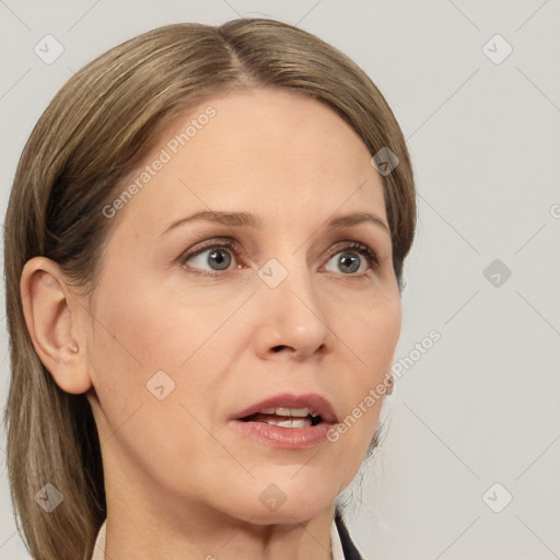 Joyful white adult female with medium  brown hair and grey eyes