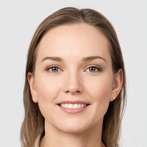 Joyful white young-adult female with long  brown hair and grey eyes