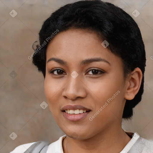 Joyful latino young-adult female with short  black hair and brown eyes