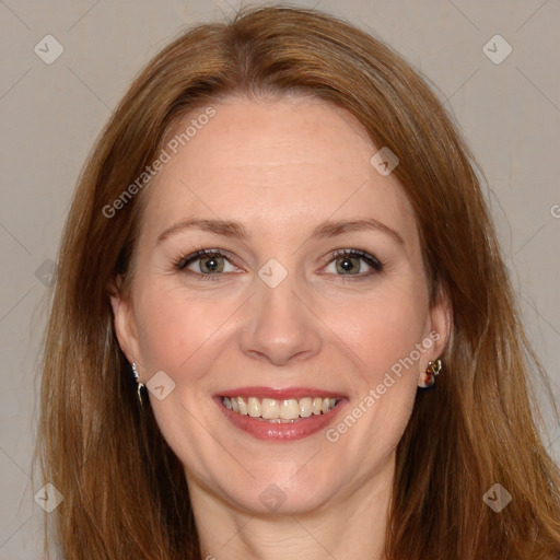 Joyful white adult female with long  brown hair and brown eyes