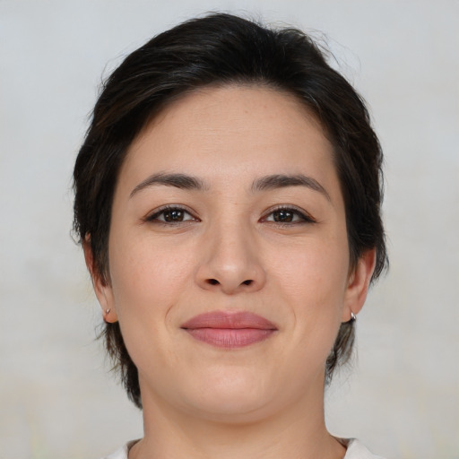 Joyful white young-adult female with medium  brown hair and brown eyes