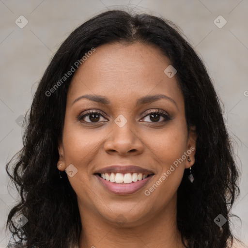 Joyful black young-adult female with long  brown hair and brown eyes