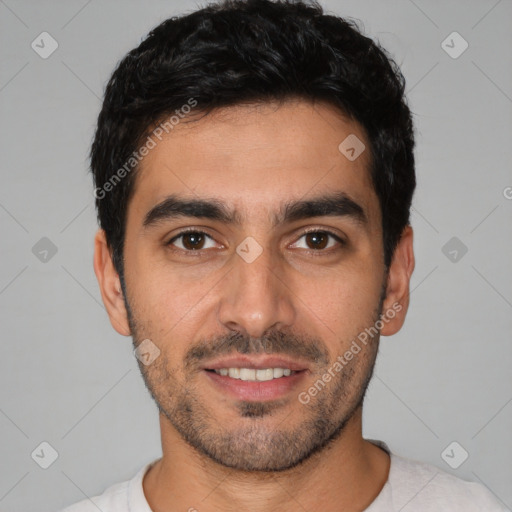 Joyful white young-adult male with short  black hair and brown eyes