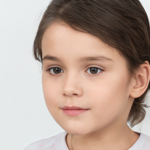 Joyful white child female with medium  brown hair and brown eyes