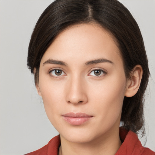 Neutral white young-adult female with medium  brown hair and brown eyes