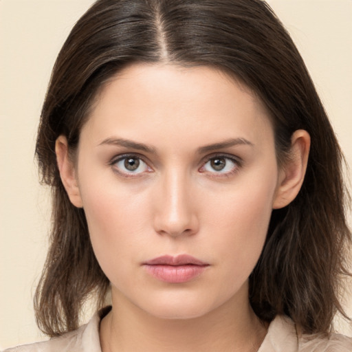 Neutral white young-adult female with medium  brown hair and brown eyes