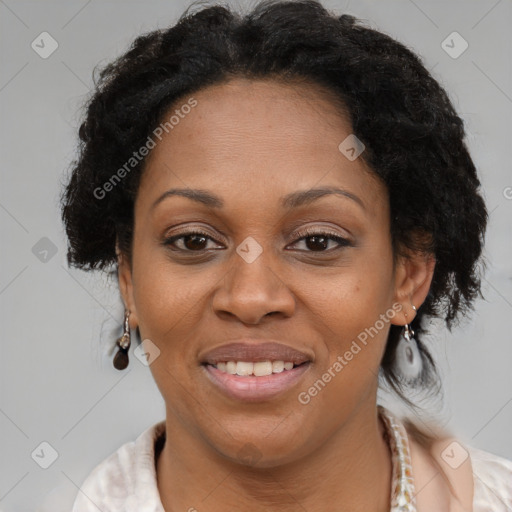 Joyful black adult female with short  brown hair and brown eyes