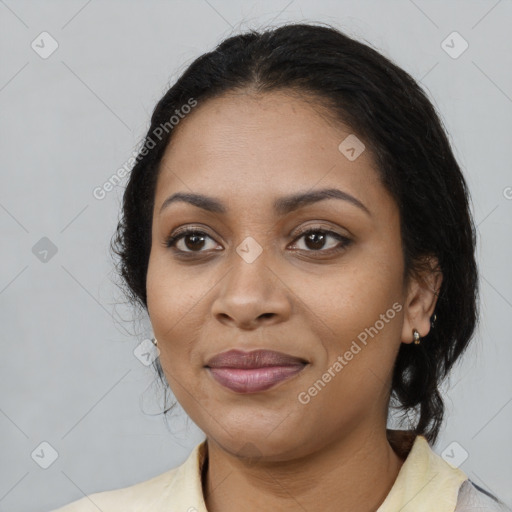 Joyful black young-adult female with medium  black hair and brown eyes