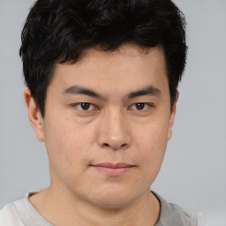 Neutral asian young-adult male with short  brown hair and brown eyes