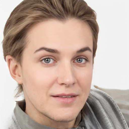 Joyful white young-adult female with short  brown hair and grey eyes