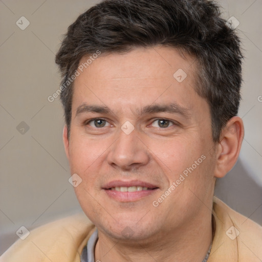 Joyful white adult male with short  brown hair and brown eyes