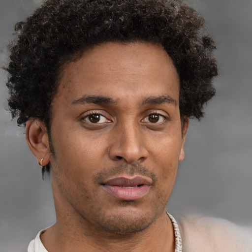 Neutral black young-adult male with short  brown hair and brown eyes