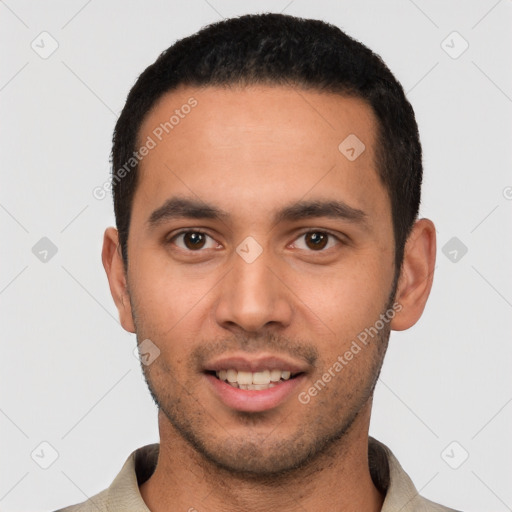 Joyful white young-adult male with short  black hair and brown eyes