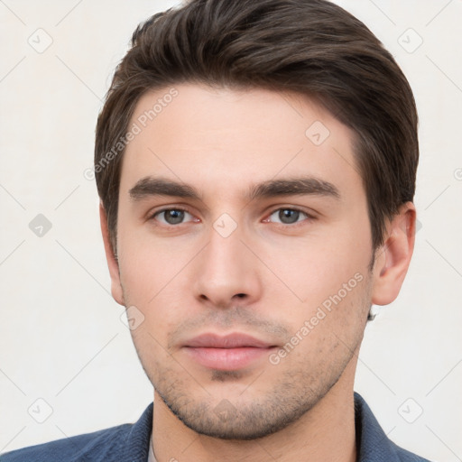 Neutral white young-adult male with short  brown hair and brown eyes