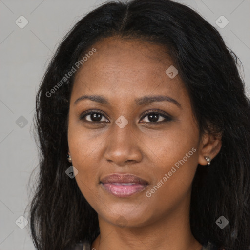 Joyful black young-adult female with long  brown hair and brown eyes