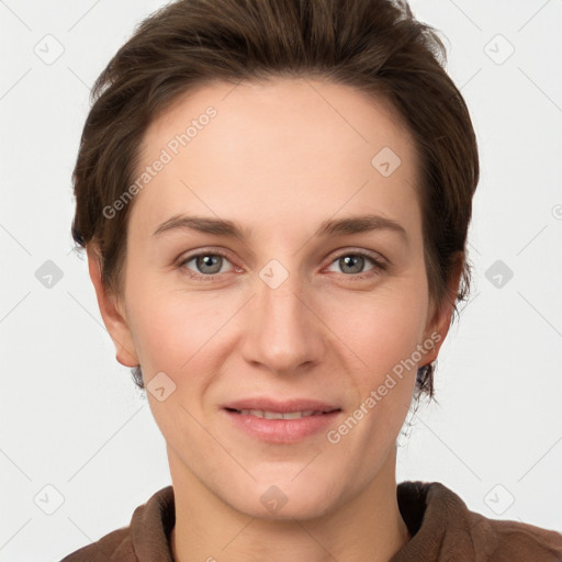 Joyful white young-adult female with short  brown hair and grey eyes