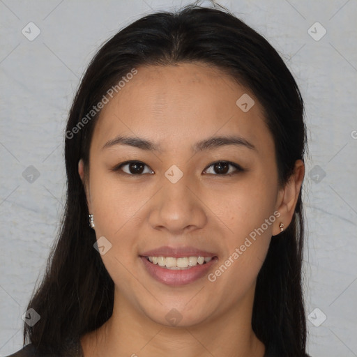 Joyful asian young-adult female with long  brown hair and brown eyes