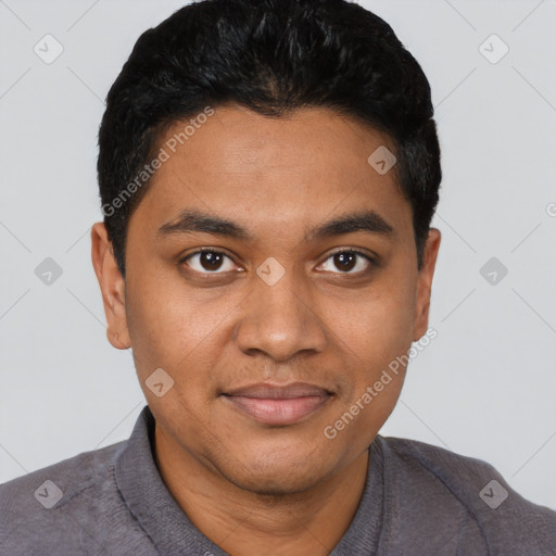 Joyful black young-adult male with short  black hair and brown eyes