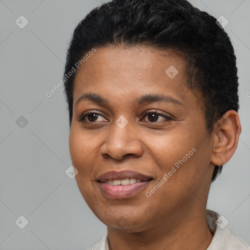 Joyful black adult female with short  brown hair and brown eyes