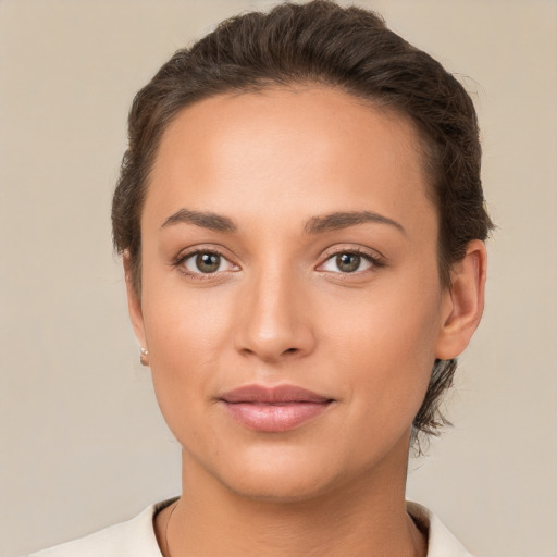 Joyful white young-adult female with short  brown hair and brown eyes