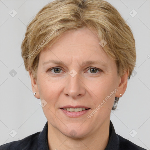 Joyful white adult female with short  brown hair and grey eyes