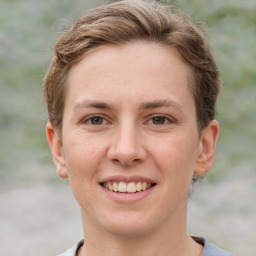 Joyful white young-adult female with short  brown hair and grey eyes