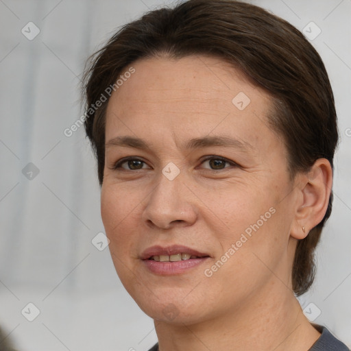 Joyful white adult female with short  brown hair and brown eyes