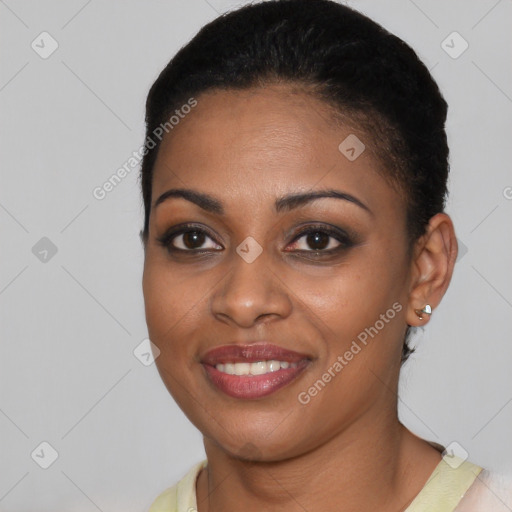 Joyful black young-adult female with short  brown hair and brown eyes