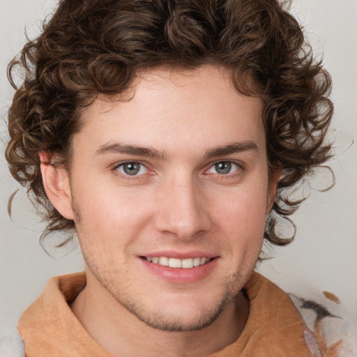 Joyful white young-adult male with medium  brown hair and brown eyes