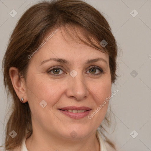 Joyful white adult female with medium  brown hair and grey eyes