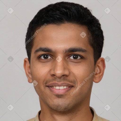 Joyful latino young-adult male with short  black hair and brown eyes