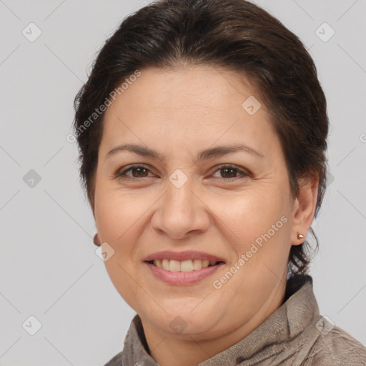 Joyful white adult female with short  brown hair and brown eyes