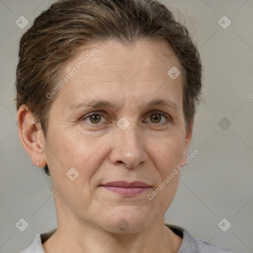 Joyful white adult female with short  brown hair and brown eyes